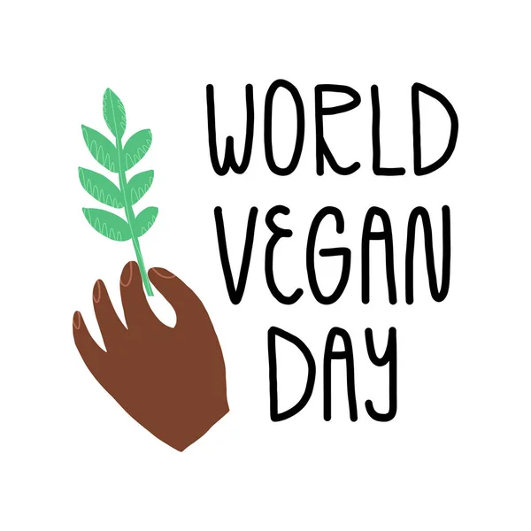 Světový veganský prapor s ručně psanými písmeny. Vegetariánský, veganský symbol jídla. Ruka drží zelenou větev, list — Stockový vektor