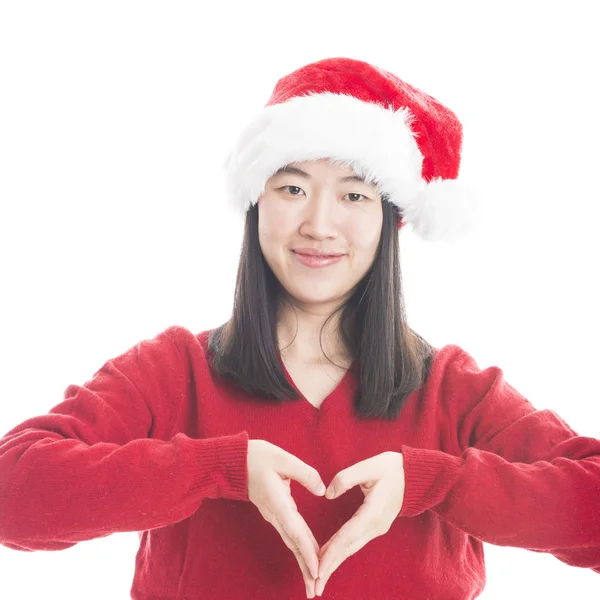 Jeune femme asiatique avec chapeau de Noël isolé sur blanc . — Photo