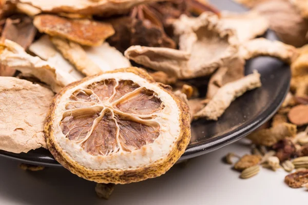 Different spices in the black plate. — Stock Photo, Image