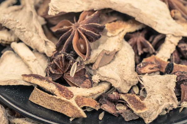 Different spices in the black plate. — Stock Photo, Image