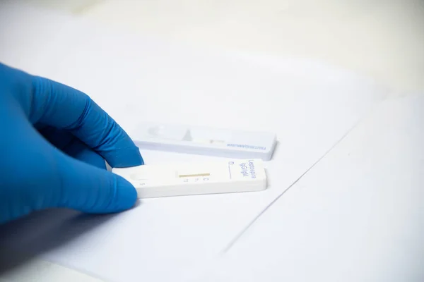 Test tube in laboratory testing on blue background.