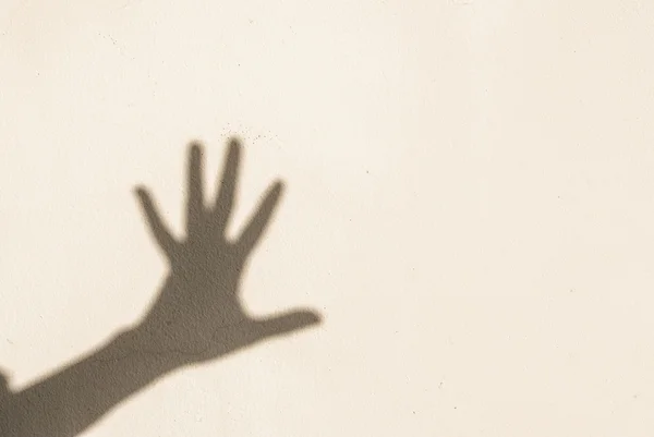 Hand in shadow — Stock Photo, Image