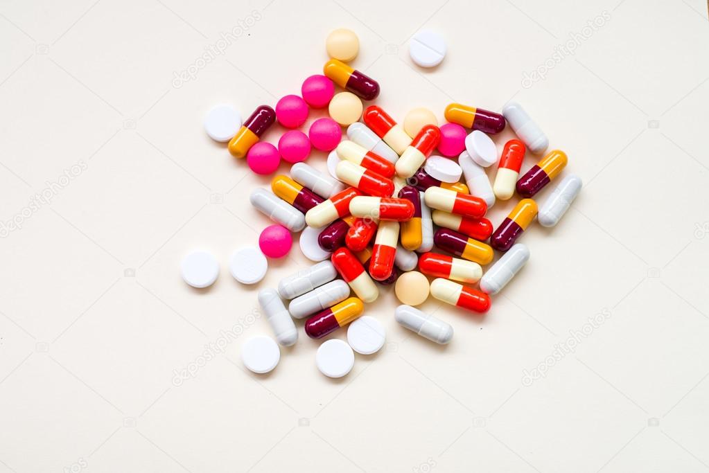 diferent Tablets pills capsule heap mix therapy drugs doctor flu