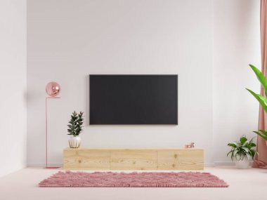 Oturma odasının duvarına monte edilmiş bir televizyon duvarı. Üzerinde beyaz bir duvar resmi var.