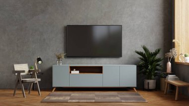 Oturma odasının içinde, beton duvarlı 33D döşemeli, beton odasındaki dolapta televizyon var.