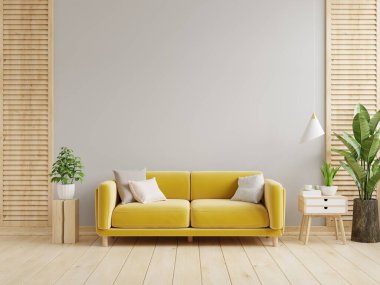 Gri duvarlı oturma odasında sarı kanepe ve dekorasyon var.
