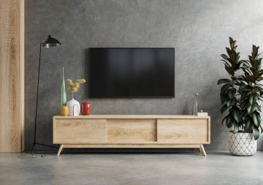 Beton duvarlı, karanlık bir odaya monte edilmiş bir televizyon duvarı.