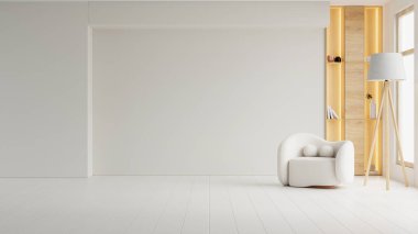 Zarif bir koltuk ve ahşap bir rafın yer aldığı minimalist oturma odası 2026 Bulut Dansçısı renk trendini fotokopi alanı için boş bir duvarla vurguluyor.