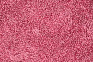 Lüks, yumuşak, pembe, havluyla kaplanmış bir arka plan.