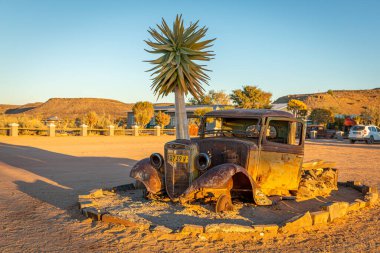 Abandoned car in the desert of Namibia. clipart