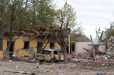 Civil buildings damaged by the missile launched by Armenia. War crime. Barda city, Azerbaijan: 10 October 2020. clipart