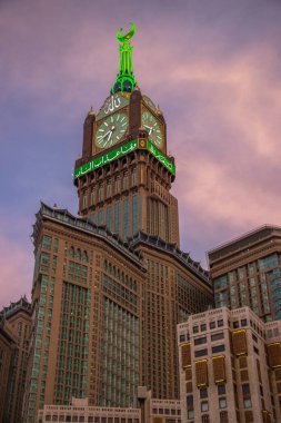 Abraj Al Bait: Royal Clock Tower in Mecca. Sunset time in Mecca - Saudi Arabia. August 2018 clipart