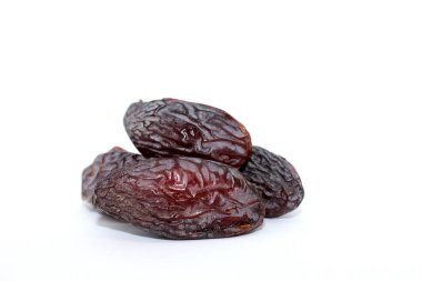 Fresh dried dates Medjool, close-up isolated on white background. Iftar food