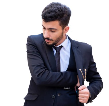 Arap iş adamı elbisesinin içinde bir şey saklıyor ve göstermek üzere.