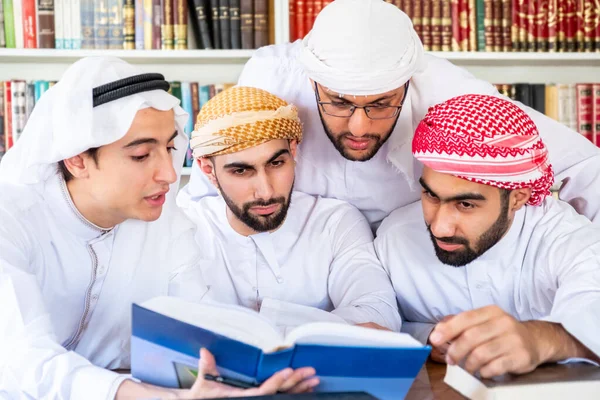 Group of arabic guys studying for exam together