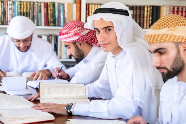 Group of arabic guys studying for exam together