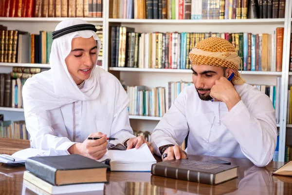 Group of arabic guys studying for exam together