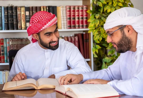 Group of arabic guys studying for exam together