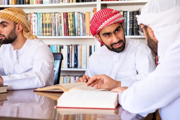 Group of arabic guys studying for exam together