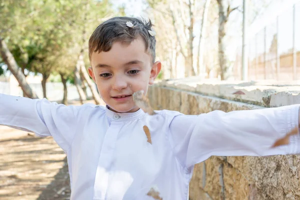 Happy Arabic Boy Enjoying Playing Dried Leaves Park — Stock Photo, Image