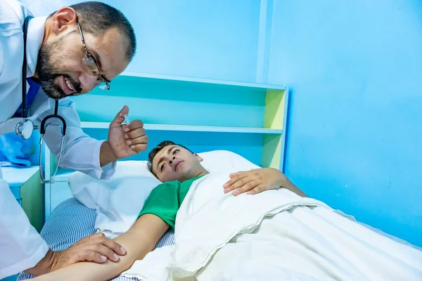 Doctor treating patient with needle