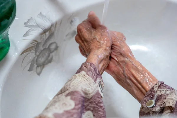 Old Woman Washing Her Hands — Stock Photo, Image