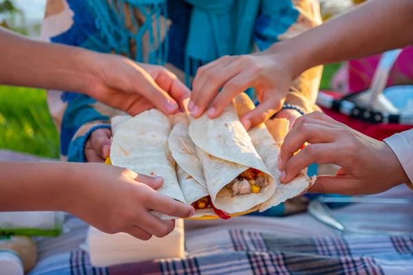 giving food to everyone in the picnic