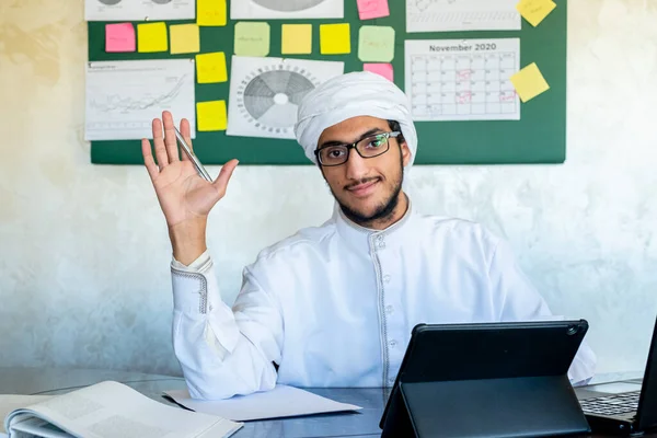 Happy male coach teacher webinar speaker looking at camera giving online class lecture or making conference video chat call, smiling muslim businessman entrepreneur recording video training, webcam view