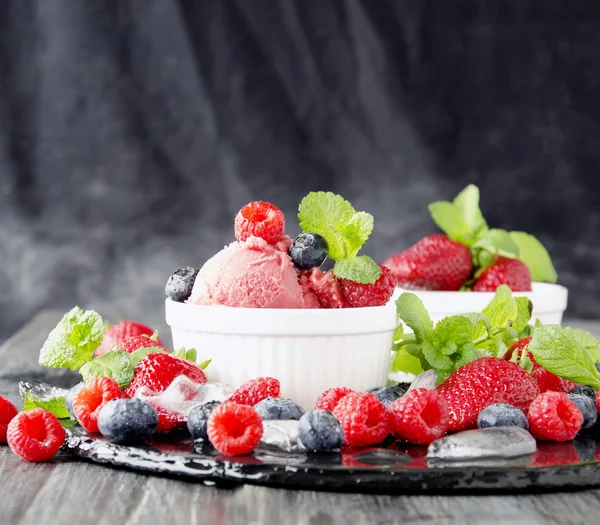 fruit ice cream with fresh strawberries, blueberries and raspberries