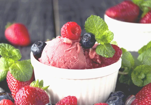 fruit ice cream with fresh strawberries, blueberries and raspberries