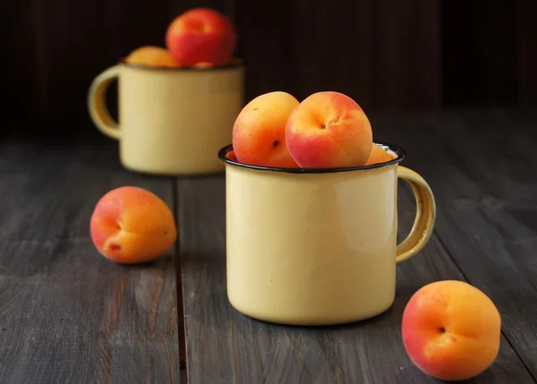 Juicy fresh peaches in a bucket