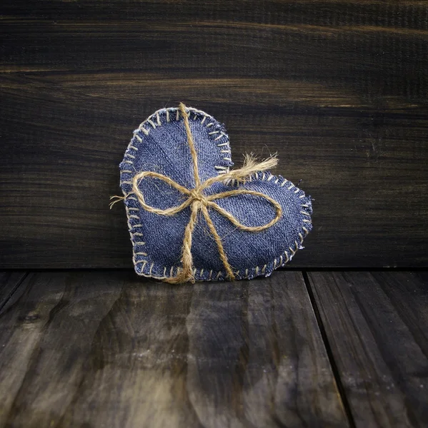 Jeans heart on wooden background — Stock Photo, Image