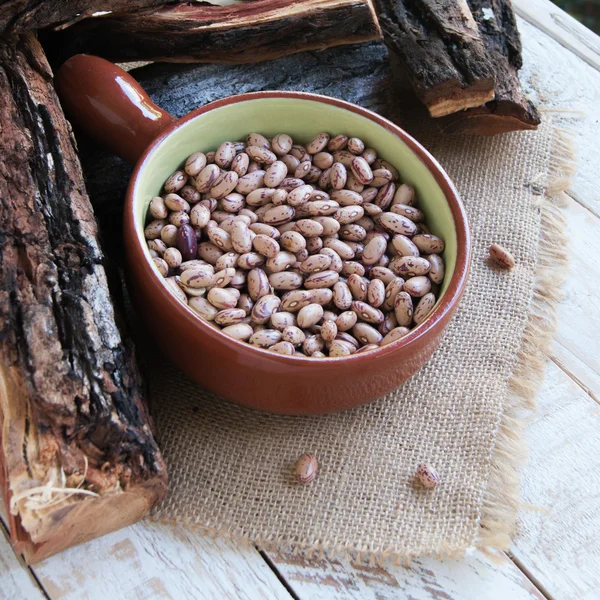 Bowl with raw beans in a rustic style — Stock Photo, Image