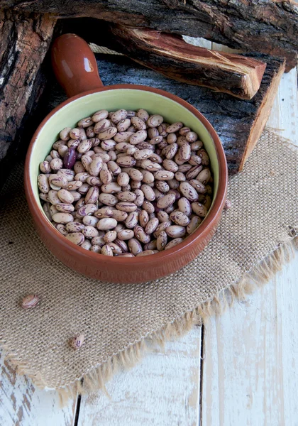 Bowl with raw beans in a rustic style — Stock Photo, Image