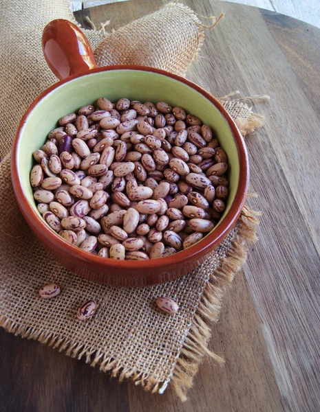 Bowl with raw beans in a rustic style — Stock Photo, Image