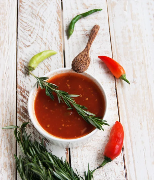 Bowl of tomato hot sauce with peppers — Stock Photo, Image