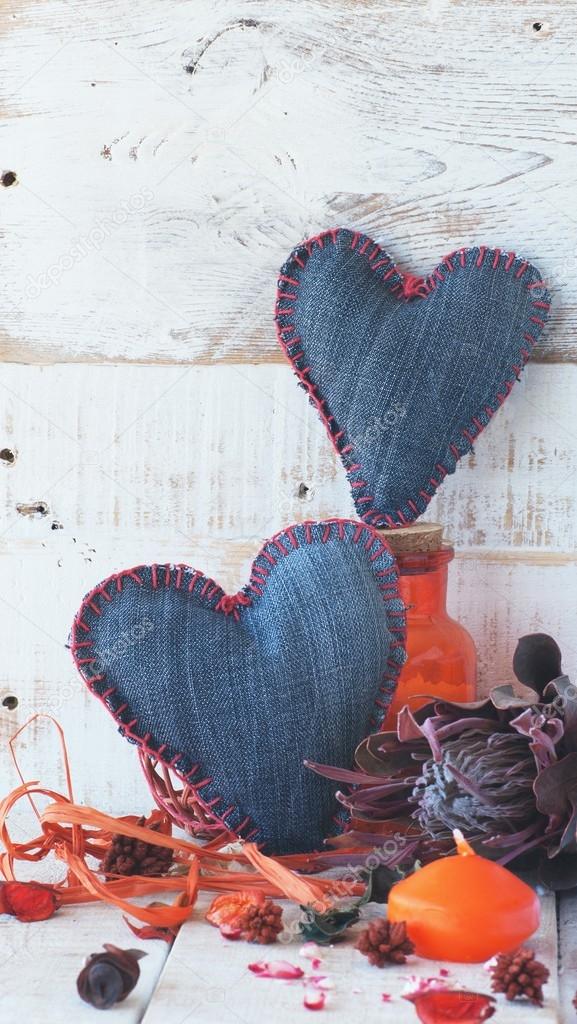 Denim hearts on a wooden background, selective focus