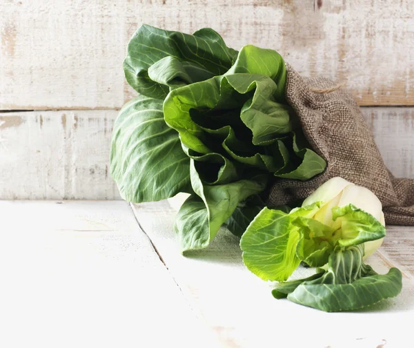 Baby bok choy on a wooden table — Stock Photo, Image