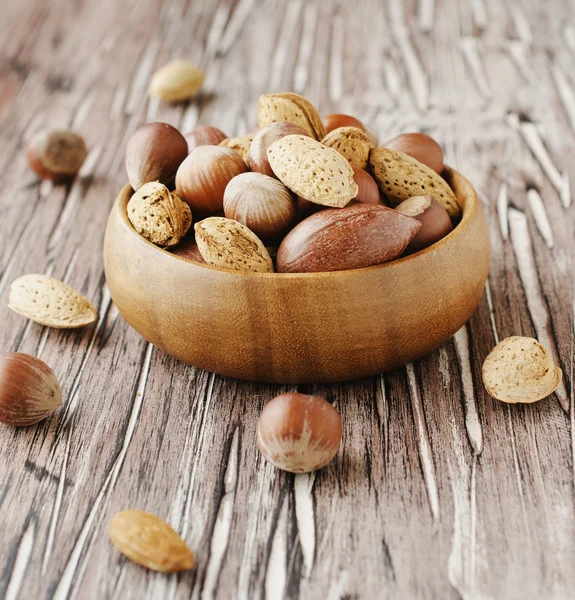 Canvas bag with nuts on a wooden table — Stock Photo, Image