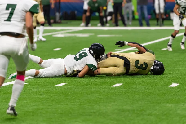 Amazing athletes making great catches and runs during a competitive football game