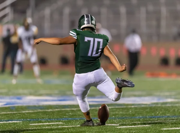 Amazing athletes making great catches and runs during a competitive football game