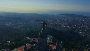 4k stunning aerial view on the Expiatory Church of the Sacred Heart of Jesus in Barcelona.