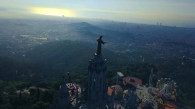 4k stunning aerial view on the Expiatory Church of the Sacred Heart of Jesus in Barcelona.