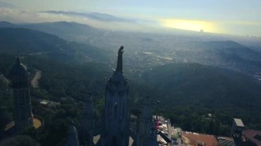 4k stunning aerial view on the Expiatory Church of the Sacred Heart of Jesus in Barcelona.