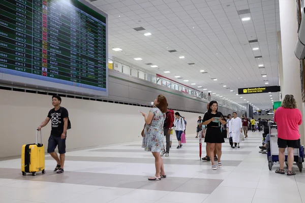 People walking in airport Thailand