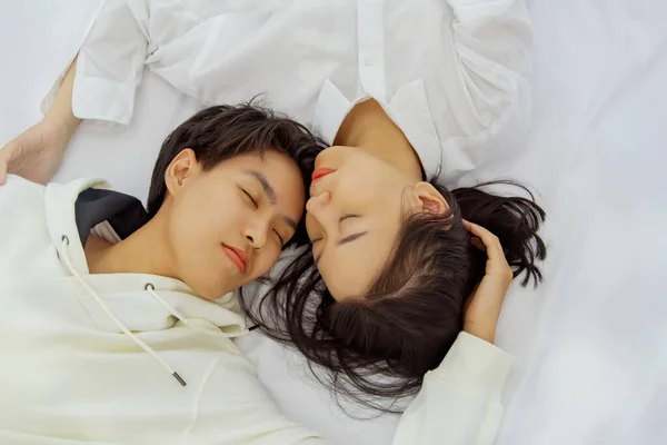 Top view Sleep with lesbian (LGBT) couples in bed, bonding : Concept Alternative sex