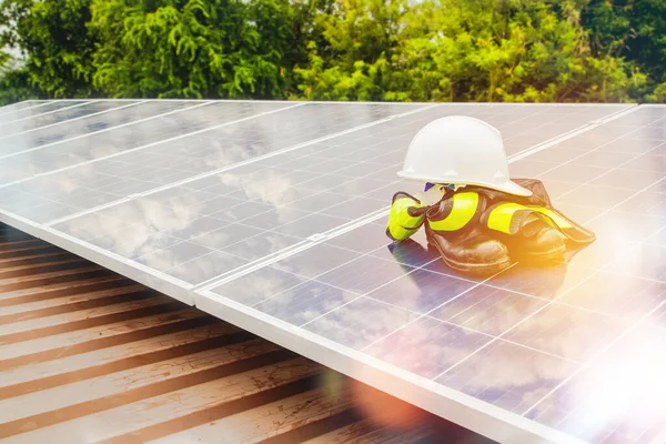 Safety protection devices during the installation of solar panels on the roof of an industrial factory.