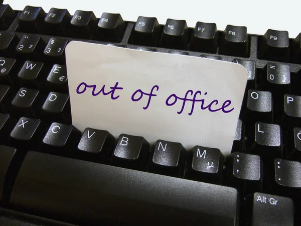 Out of office notice on a keyboard