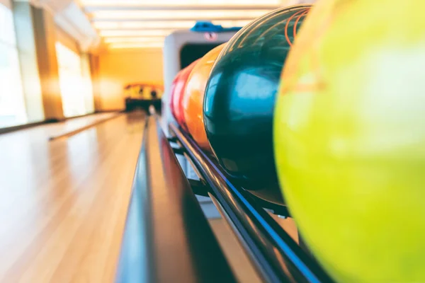 Blurred soft images of Bowling ball on the track prepared for athletes who exercise, to sport and recreation concept.