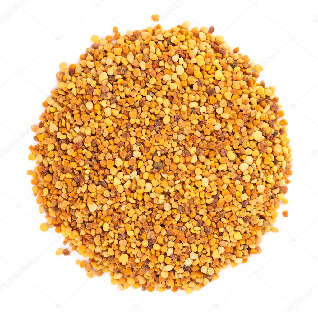 Flower pollen grains, isolated on white background. Pile of bee pollen or perga. Top view